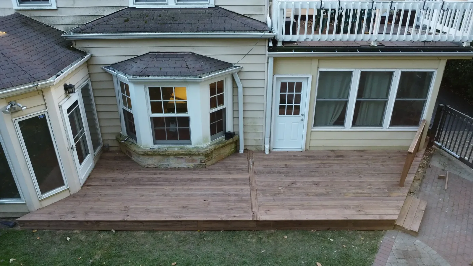 Overhead view of deck boards fitted around the projecting bay window