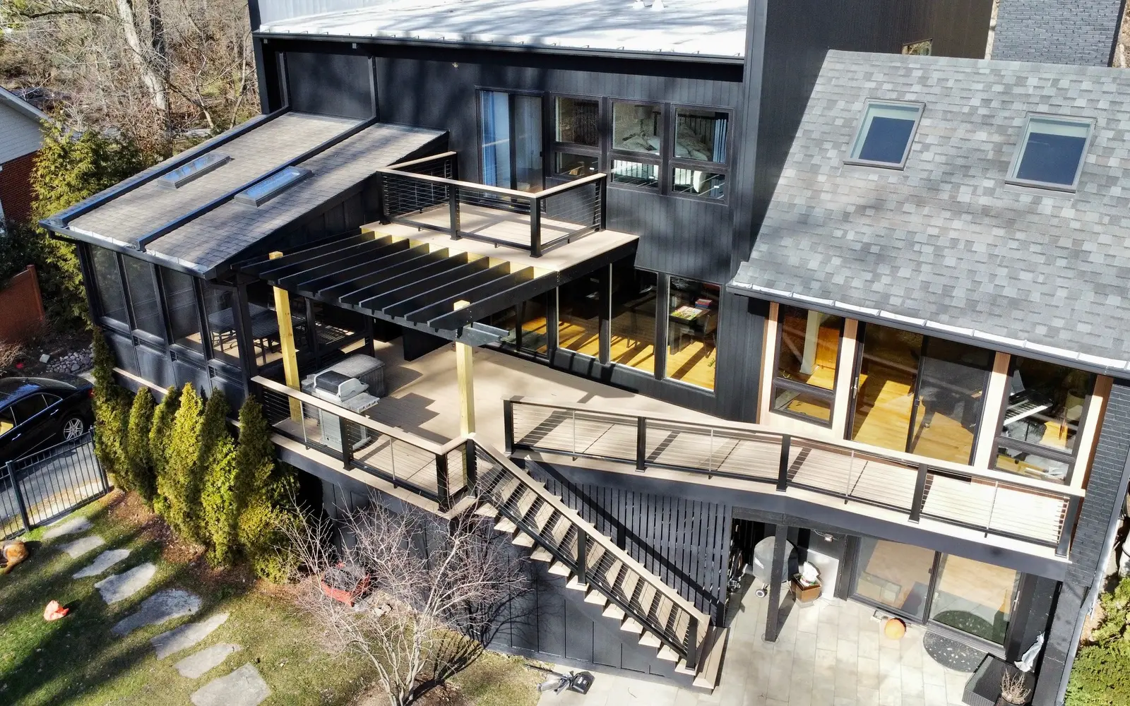 TimberTech wraparound deck with horizontal cable railings on a Glen Ellyn home