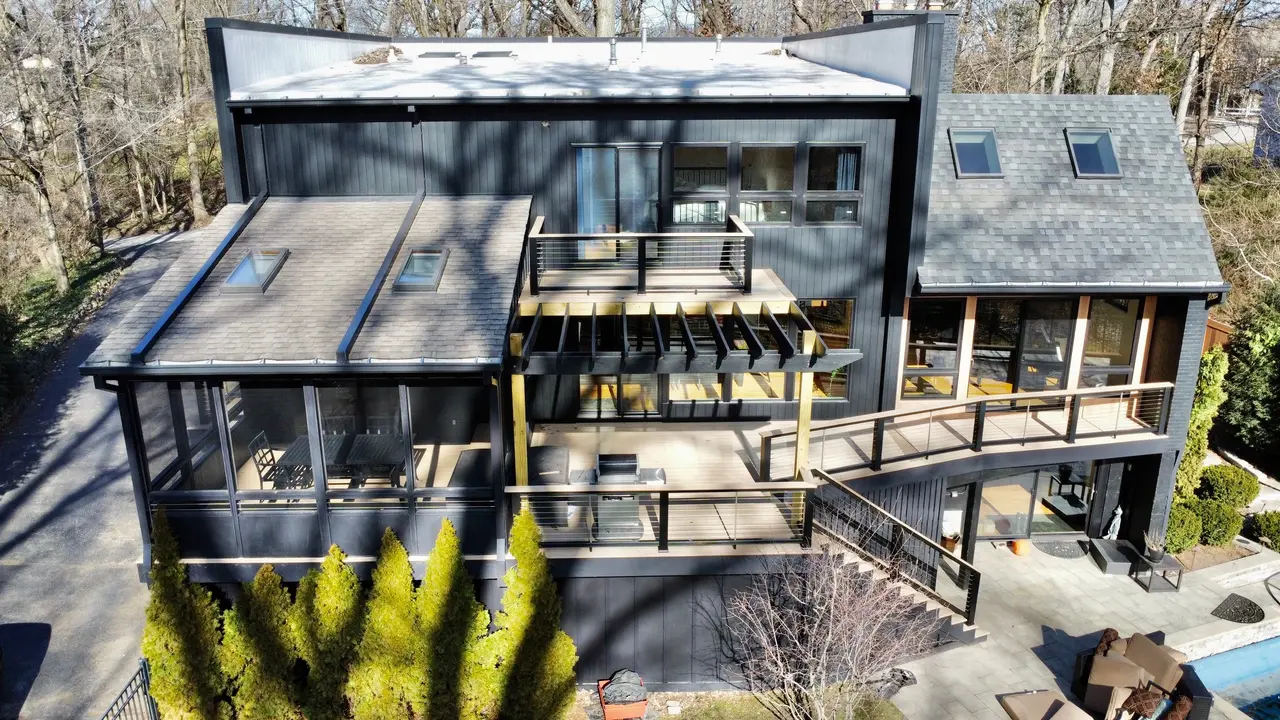 Wide view of a wraparound deck with horizontal cable railings on a Glen Ellyn home